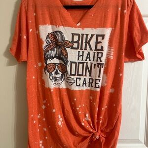 Orange Graphic Tee with Skull Design